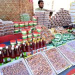 A vendor displaying Dates to attract the customers during Holy Fasting Month of Ramzan at Miro Khan Road