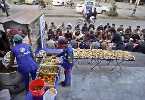 Volunteers prepare iftar meals for fasting people ahead of sunset during the holy month of Ramazan at National Market in the twin cities. APP/IFD/TZD/SSH