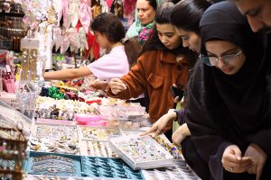 Women busy selecting and purchasing bangles from a stall at Jinnah Super Market ahead of Eid-ul-Fitr in the Federal Capital