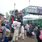 A large number of people arrives at the railway station to leave for their home town to celebrate Eidul Fitr with their loved ones