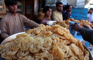 A vendor sells golden, tempting Jalebis to customers ahead of Iftar during the holy month of Ramazan.