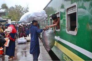 A large number of people arrives at the railway station to leave for their home town to celebrate Eidul Fitr with their loved ones