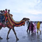 Children enjoying camel ride at Sea View on the second day of Eid-ul-Fitr