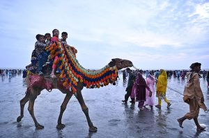 Children enjoying camel ride at Sea View on the second day of Eid-ul-Fitr