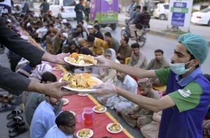 Volunteers prepare iftar meals for fasting people ahead of sunset during the holy month of Ramazan at National Market in the twin cities. APP/IFD/TZD/SSH