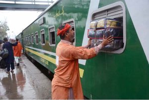 A large number of people arrives at the railway station to leave for their home town to celebrate Eidul Fitr with their loved ones