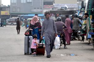 A large number of passengers waiting for bus to leave for their hometowns at the General Bus Stand to celebrate Eid ul Fitr festival with their loved ones