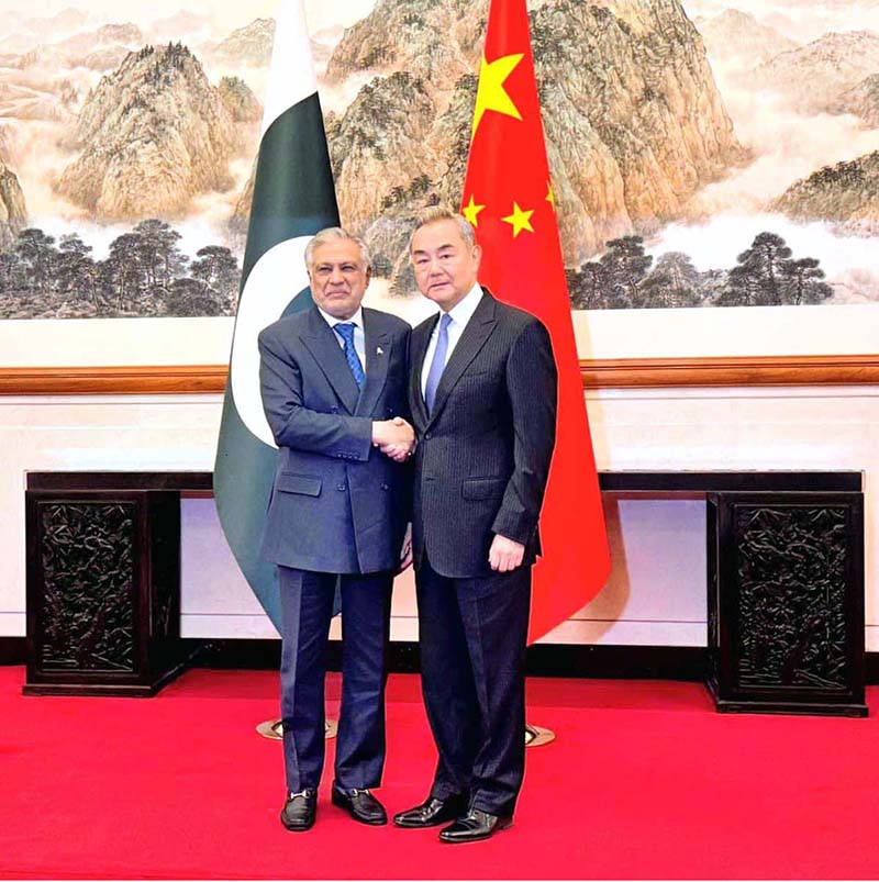 Deputy Prime Minister and Foreign Minister, Senator Mohammad Ishaq Dar, is received by Foreign Minister of China, Wang Yi at the Diaoytai State Guest House