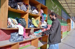Vendor displaying school bags to attract the customers at his setup