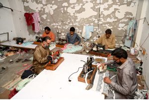 Tailors busy in cloth preparing work as per high demand of customers ahead of Eid ul Fitr at Gol Chowk.