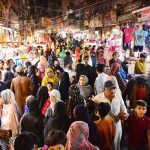 A large number of people are busy shopping in preparation of Eidul Fitr at Resham Bazaar