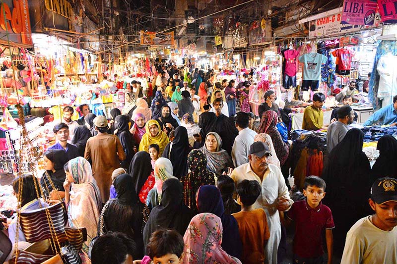 A large number of people are busy shopping in preparation of Eidul Fitr at Resham Bazaar