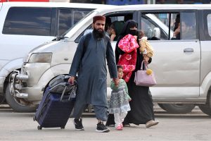 A large number of passengers waiting for bus to leave for their hometowns at the General Bus Stand to celebrate Eid ul Fitr festival with their loved ones
