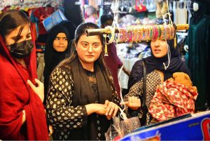 A large number of people are busy shopping in preparation of Eidul Fitr at Resham Bazaar