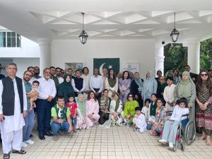 High Commissioner Rabia Shafiq hoisting the national flag at Pakistan House, to the tune of the National Anthem, marking the commemoration of the 86th National Day of Pakistan