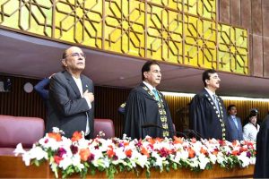 President Asif Ali Zardari, Speaker National Assembly Sardar Ayaz Sadiq and Chairman Senate Syed Yousuf Raza Gilani stand for the National Anthem at the joint session of Parliament at Parliament House