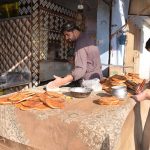 A naanbai prepares traditional kulchas for Sehri during Ramazan, keeping alive the flavor of local culinary traditions.
