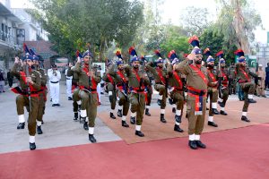 Commissioner Amir Kareem Khan and RPO Muhammad Usman Akram Gondal hoisting the National flag to mark the Pakistan Day ceremony at the DC office