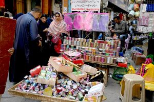 A vendor displays and sells freshly fried Nimko and Papri, attracting customers during the holy month of Ramazan