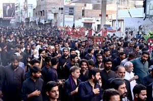 A large number of mourners attending the procession on Yom-e-Shahadat of Hazrat Ali (RA) at AL-Rahim Shopping center roads