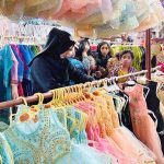 Women along with children are busy selecting dresses at Eid Free Bazaar “Maa Hum Bhi Eid Manyen Gay” organized by JDC Welfare Foundation