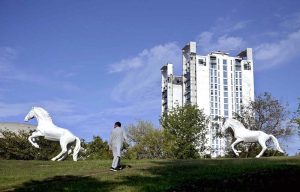 A motorcyclist crosses in front of the newly installed “I Love Islamabad” sculpture at the Convention Center, enhancing the beauty of the federal capital