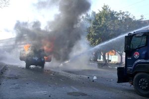 Security personnel manage to contain the protestors as they gather near U.S. Consulate, against attacks on Iran that led to martyrdom of Iranian Supreme Leader Ayatollah Seyyed Ali Khamenei