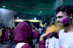 Hindu devotees offer prayers while celebrating Holi at Shree Punch Mukhi Hanuman Mandir.