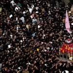 A large number of people participating in a procession marking the death anniversary of Imam Ali, cousin of Prophet Muhammad (PBUH)