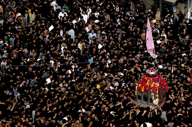 A large number of people participating in a procession marking the death anniversary of Imam Ali, cousin of Prophet Muhammad (PBUH)
