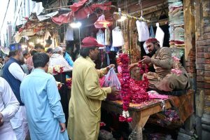 People are busy purchasing flowers and garlands to receive their relatives who complete Itikaf on the last night of Ramazan