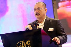 Sharjeel Inam Memon, Sindh Senior Minister and Provincial Minister for Information, Transport and Communication, along with others, hands over the key of a scooty to a woman during a ceremony for the distribution of scooties on the occasion of International Women’s Day at a local hotel