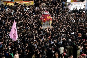 A large number of people participating in a procession marking the death anniversary of Imam Ali, cousin of Prophet Muhammad (PBUH)