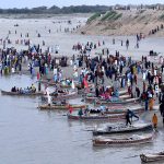A large number of people enjoying Eid holidays with boat ridding at AL-Manzar point in River Indus