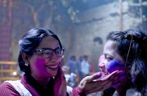 Hindu devotees offer prayers while celebrating Holi at Shree Punch Mukhi Hanuman Mandir.
