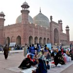 Muslim devotees break their fast with Iftar meals in the Islamic holy fasting month of Ramazan, at the historical Badshahi mosque in the Provincial Capital.
