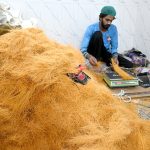 A worker packing vermicelli ahead of Eid ul Fitr festive at his workplace in the city