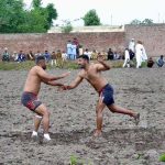 Players in action during a kabaddi match at Chak No. 13 Kalro in Chiniot