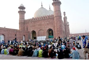 Muslim devotees break their fast with Iftar meals in the Islamic holy fasting month of Ramazan, at the historical Badshahi mosque in the Provincial Capital.