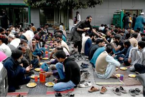 Volunteers prepare and arrange food items during Free Iftar at the roadside in the I-9 sector during the holy fasting month of Ramazan.