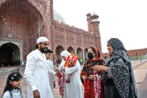 People receiving faithful who complete Itikaf at Badshahi Masjid on the last night of Ramazan