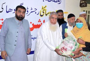 General Secretory Rafa Society Khwaja Mohammad Umar distributing Rashaan to deserving people at Rafa Hospital.