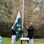Pakistan's Ambassador to Romania, Ilyas Mehmood Nizami hoists the flag at a National Day ceremony
