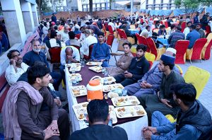 Member of Punjab Assembly Hina Arshad Warraich distributing Iftar food among the public at Government Allama Iqbal Teaching Hospital during her visit.