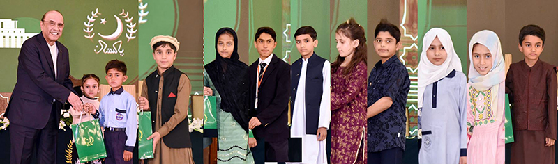 President Asif Ali Zardari presents gifts to orphan children during an Iftar dinner hosted at Aiwan-e-Sadr in connection with the observance of Orphans Day