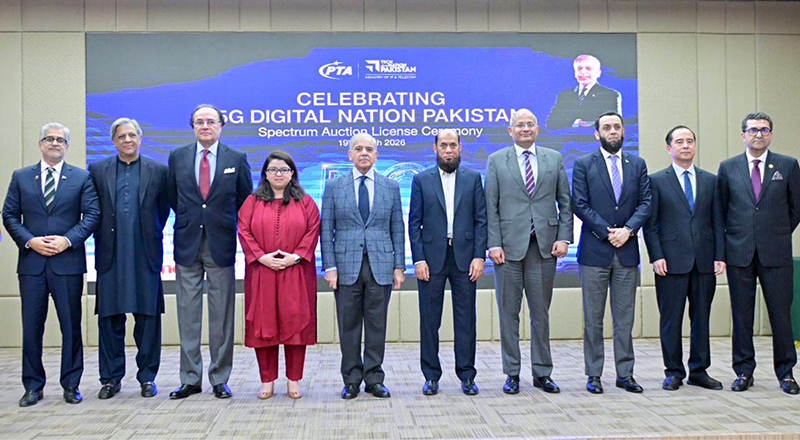Prime Minister Muhammad Shehbaz Sharif in a group photo with owners of telecommunications companies who participated in the Spectrum Auction License Ceremony
