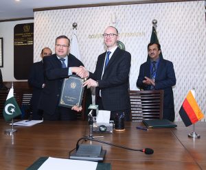 Secretary Economic Affairs Division, Muhammad Humair Karim and Sebastian Jacobi, Country Director of the German Government Bank for Development (KfW), signing a grant agreement. APP/ABB