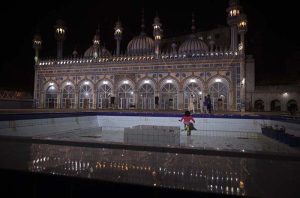 A beautiful view of Qadeemi Jamia Masjid reflected in water during the night of Lailatul Qadr in the holy month of Ramazan.