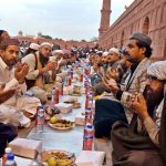 Faithful offering dua while waiting for the Maghrib Azaan to break their fast on the last day of Ramazan at Badshahi Masjid in the provincial capital