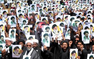 Participants offering Namaz-e-Zuhrain during the main mourning procession on the occasion of Youm-e-Ali at M.A. Jinnah Road